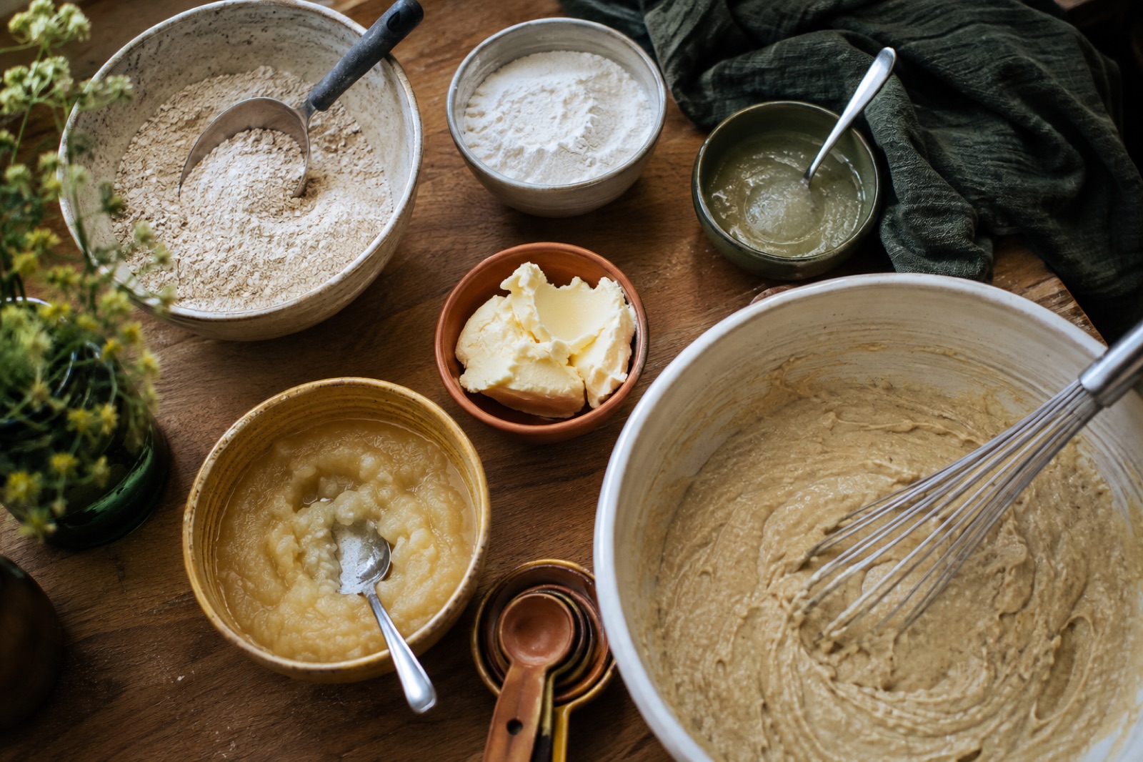 Parent and child cooking together in a bright kitchen, making allergy-safe cookies